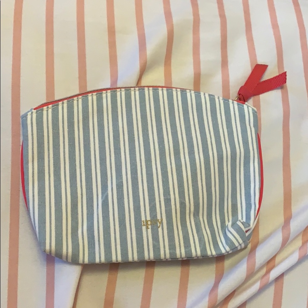 White, blue, and pink Ipsy bag